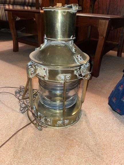 Den. Ships lantern. Approximately 18 inches tall. It has an AC adapter for it.