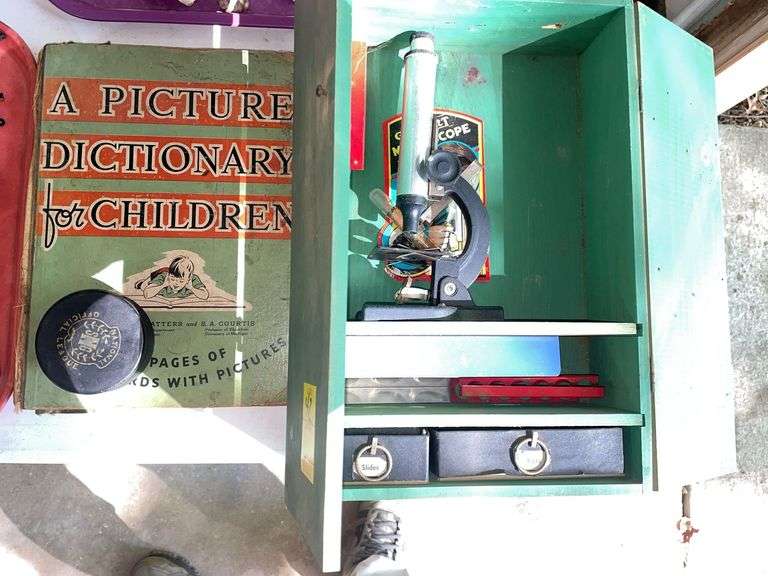 Garage. Gilbert microscope in case with accessories. A picture dictionary for children approximately from the 1930s and older hockey puck.