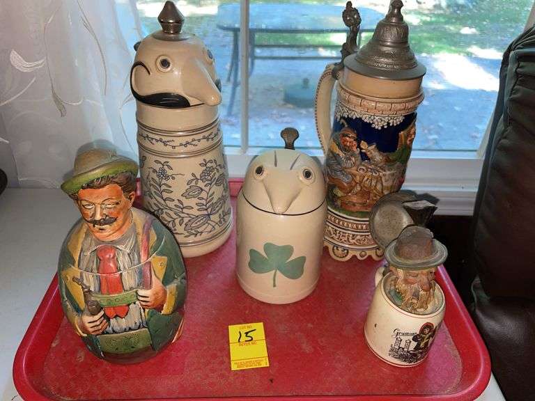 Den. Four very unique Steins with a mini with wine cork.