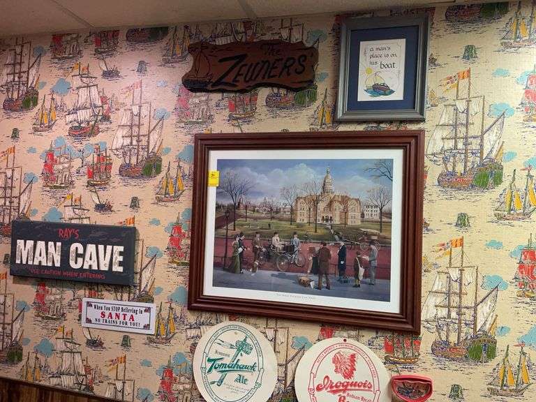 Basement. Wall decor featuring print of the first Packard car show.