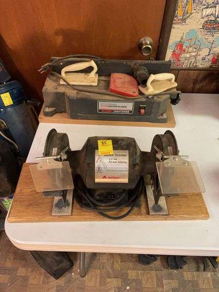 Basement. Craftsman four 1/8 inch joint planner and bench grinder by all trade.