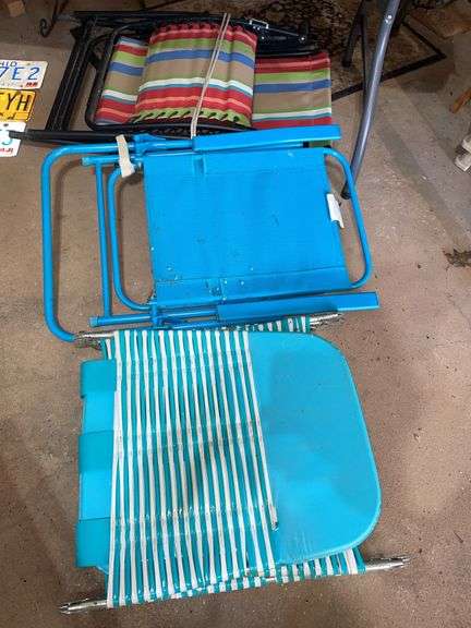 Garage. Three folding yard chairs.