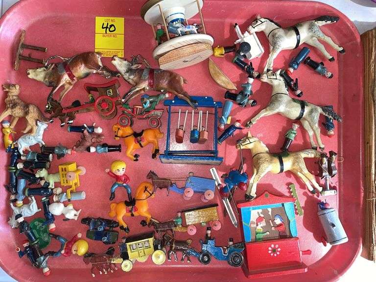 Garage. Tray a very vintage children’s toys. Small figures.