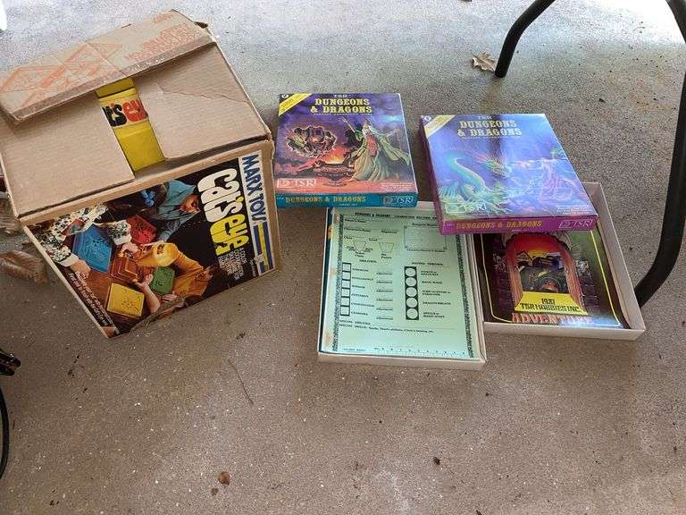 Garage. Cats eye vintage game and two dungeons and dragons booklets with vintage boxes. Unsure if the DD is complete. Please inspect at preview. No refunds