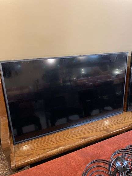 Hitachi 50 inch flatscreen television with wall anchor on back. Powered ...