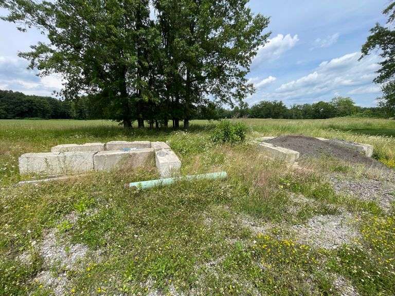 14 bin blocks with rebar handle. This lot also includes heavy piece of pipe and barrel. Must be removed within 7 days easy access. By the piece