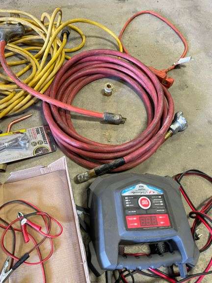 ￼ lot includes battery, tester, battery, charger, electrical tools, stapler, cords, and miscellaneous