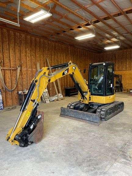 CAT 305E CR. Compact mini track excavator. Rubber tracks. Approximately 40.2 hp. Cat C2 .4 diesel engine. 129 inch dig depth. 220 inch reach. Full cab with 78 inch blade 24 inch bucket with thumb. 189 hours on meter. Product ID number CAT0305EVH5M11929. Stored in garage. See Photos for Video of Vehicle running-$1,000 Credit Card Deposit. Balance by Cash, Certified Check or ACH within 48 hours after sale.