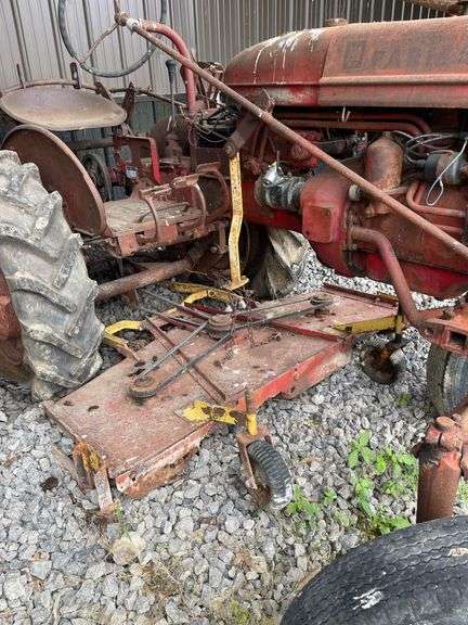 1959 Farmall model a wide front utility road tractor. 2 Wheel Dr. Gasoline engine. With attached Undermount belly mower. Serial number 3A2159