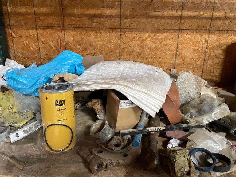 Contents of four post shelving includes oil, change, accessories, and filters for big machinery, miscellaneous hardware, fittings, scrap metal. Take what you want and leave the rest.