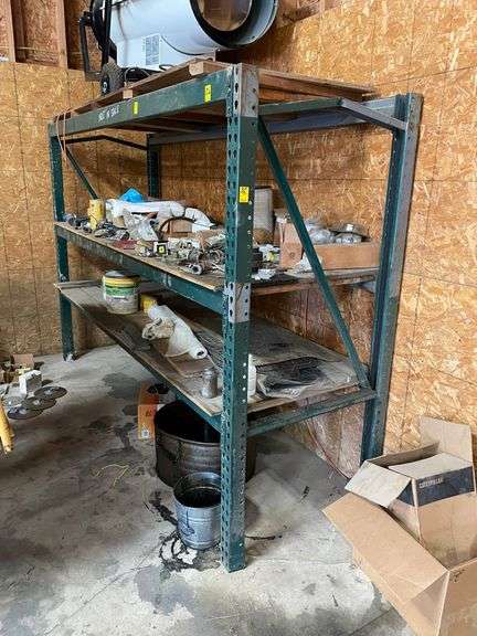heavy duty four post shelving unit 78 inches tall by 110 inches wide by 36 inches deep. This shelving unit is bent in one section but appears to be holding fast. You will need to coordinate the removal of the contents of the shelving unit.