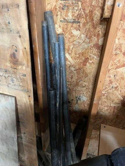 Nice lot of black pipe, track, boards, plow discs misc