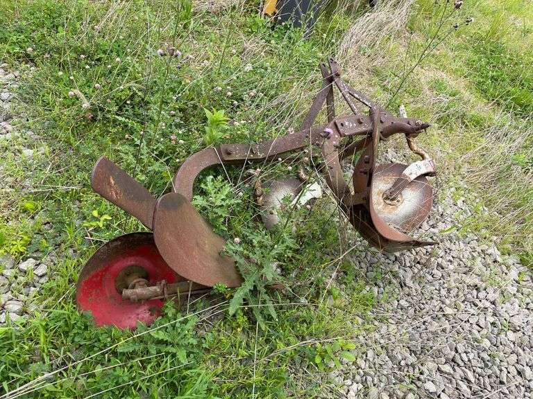 Old two bottom farm plow for farm mall tractor. Pull type.