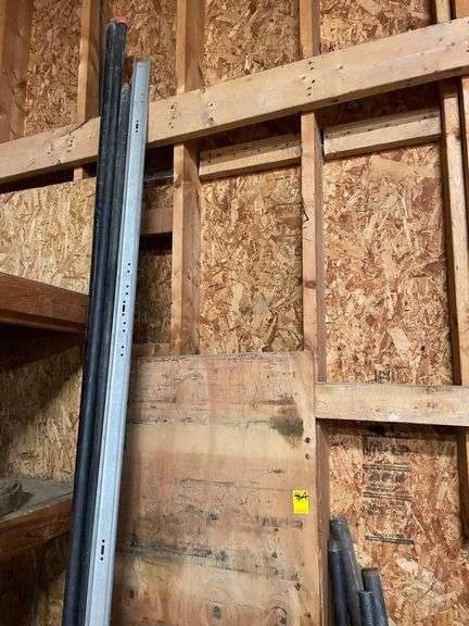 Nice lot of black pipe, track, boards, plow discs misc