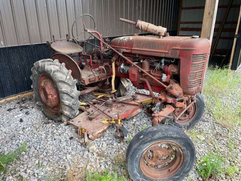 1959 Farmall model a wide front utility road tractor. 2 Wheel Dr. Gasoline engine. With attached Undermount belly mower. Serial number 3A2159