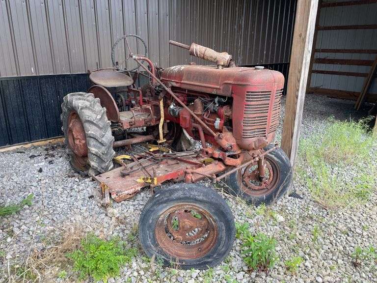 1959 Farmall model a wide front utility road tractor. 2 Wheel Dr. Gasoline engine. With attached Undermount belly mower. Serial number 3A2159