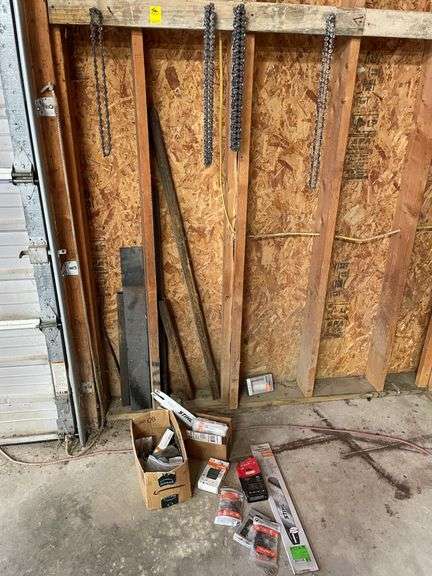 A lot of chainsaw, blades, tool and miscellaneous accessories