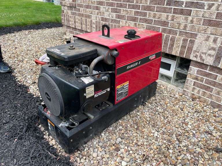 Lincoln electric Ranger eight performer 16 skid mounted generator. 714 cc engine. Gas fired. Model number P216G – I/114 21H. Electric start. By side of house.