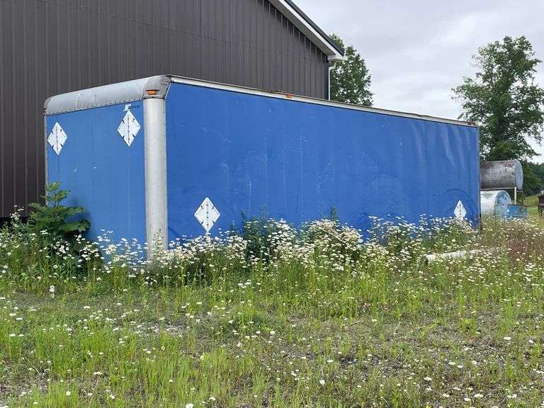 Supreme aluminum cargo box only approximately 8’ x 30’. Roll up rear door. No frame or axles. Sitting on ground used a storage shed. Does not include the contents.