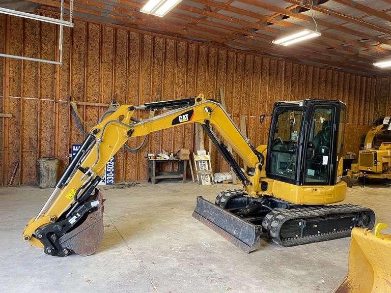 CAT 305E CR. Compact mini track excavator. Rubber tracks. Approximately 40.2 hp. Cat C2 .4 diesel engine. 129 inch dig depth. 220 inch reach. Full cab with 78 inch blade 24 inch bucket with thumb. 189 hours on meter. Product ID number CAT0305EVH5M11929. Stored in garage. See Photos for Video of Vehicle running-$1,000 Credit Card Deposit. Balance by Cash, Certified Check or ACH within 48 hours after sale.