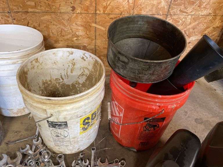 Lot of motor oil. Wrenches, sockets buckets, miscellaneous ratchets.