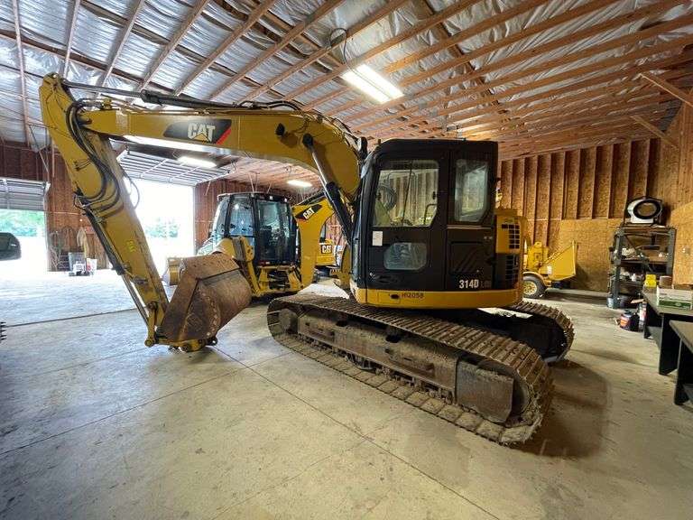 CAT314DLCR steel tracked excavator approximately 97 hp gross. One cubic yard bucket capacity. 18 to 20 foot dig depth/up to 28 feet reach depending on boom/stick option. Cab. 1351 hours on meter. 24 inch bucket. Product number CAT0314DCSSZ00420. Garage kept. See Photos for video of vehicle running-$1,000 Credit Card Deposit. Balance by Cash, Certified Check or ACH within 48 hours after sale.