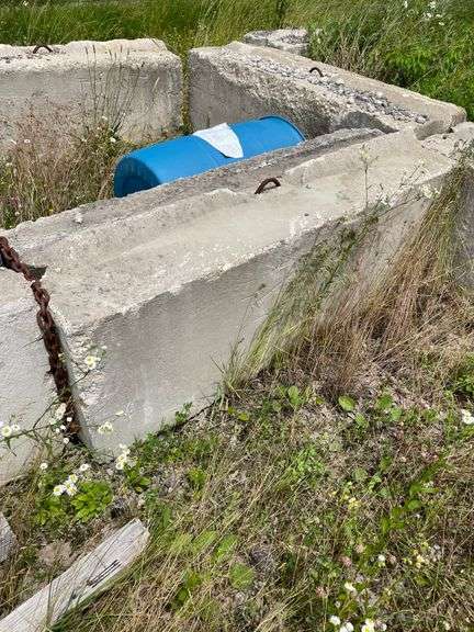 14 bin blocks with rebar handle. This lot also includes heavy piece of pipe and barrel. Must be removed within 7 days easy access. By the piece