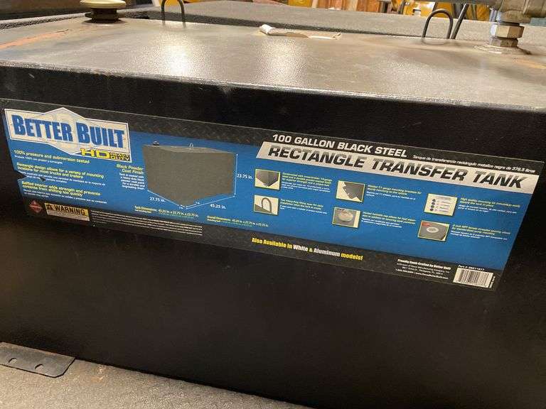 Better Build heavy duty hundred gallon black steel rectangle transfer tank. In bed of truck. Includes red fuel tank and come along chain.