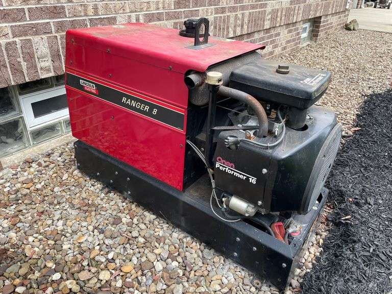 Lincoln electric Ranger eight performer 16 skid mounted generator. 714 cc engine. Gas fired. Model number P216G – I/114 21H. Electric start. By side of house.