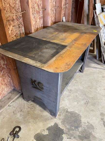 Heavy duty, KC plate metal table very sturdy measures 58 wide by 29 deep with lower shelf.  Bench height.
