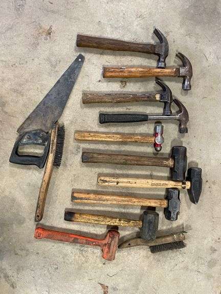 A lot of hammers, including small sledges