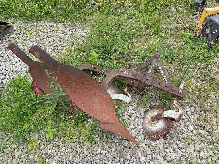 Old two bottom farm plow for farm mall tractor. Pull type.