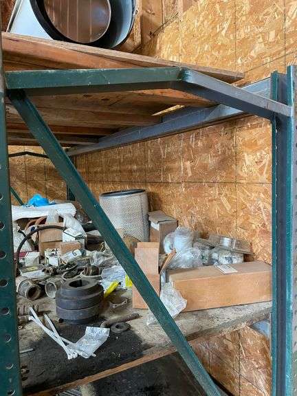 heavy duty four post shelving unit 78 inches tall by 110 inches wide by 36 inches deep. This shelving unit is bent in one section but appears to be holding fast. You will need to coordinate the removal of the contents of the shelving unit.