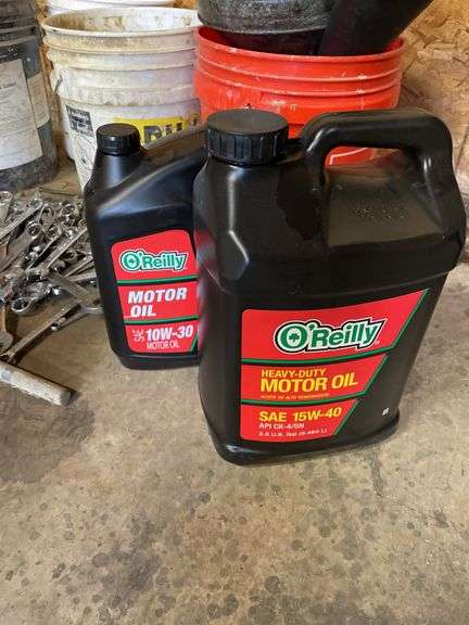 Lot of motor oil. Wrenches, sockets buckets, miscellaneous ratchets.