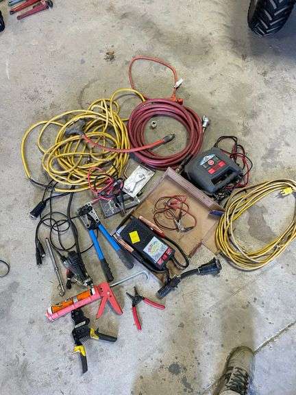 ￼ lot includes battery, tester, battery, charger, electrical tools, stapler, cords, and miscellaneous