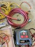 ￼ lot includes battery, tester, battery, charger, electrical tools, stapler, cords, and miscellaneous