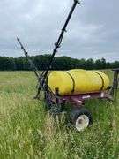 Demco model HCM. 300 gallon tub pull behind pesticide sprayer.
