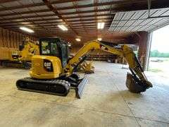 CAT 305E CR. Compact mini track excavator. Rubber tracks. Approximately 40.2 hp. Cat C2 .4 diesel engine. 129 inch dig depth. 220 inch reach. Full cab with 78 inch blade 24 inch bucket with thumb. 189 hours on meter. Product ID number CAT0305EVH5M11929. Stored in garage. See Photos for Video of Vehicle running-$1,000 Credit Card Deposit. Balance by Cash, Certified Check or ACH within 48 hours after sale.