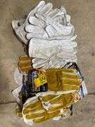 21 pairs of gloves, some are rawhide, and some are suede Tillman. By the pair