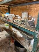 Contents of four post shelving includes oil, change, accessories, and filters for big machinery, miscellaneous hardware, fittings, scrap metal. Take what you want and leave the rest.