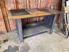 Heavy duty, KC plate metal table very sturdy measures 58 wide by 29 deep with lower shelf.  Bench height.