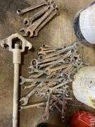 Lot of motor oil. Wrenches, sockets buckets, miscellaneous ratchets.