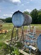 300 gallon gasoline gravity storage fuel tank on stand. Includes ladder. Also includes extra nozzle. Seller says this is gasoline. This unit is padlock. We shook the tank and it appears empty or to have very little fuel.