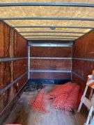 Supreme aluminum cargo box only approximately 8’ x 30’. Roll up rear door. No frame or axles. Sitting on ground used a storage shed. Does not include the contents.