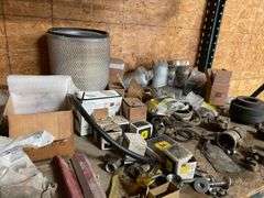 Contents of four post shelving includes oil, change, accessories, and filters for big machinery, miscellaneous hardware, fittings, scrap metal. Take what you want and leave the rest.