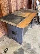 Heavy duty, KC plate metal table very sturdy measures 58 wide by 29 deep with lower shelf.  Bench height.