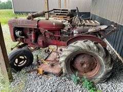 1959 Farmall model a wide front utility road tractor. 2 Wheel Dr. Gasoline engine. With attached Undermount belly mower. Serial number 3A2159