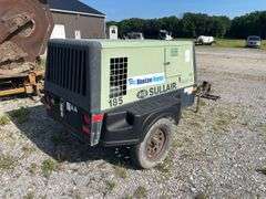 SullAir model 185 portable diesel construction site air compressor. Single axle pool type. Running at setup, started immediately
