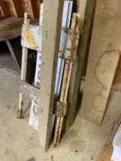 Lot of lumber, signage, and wood pallet.