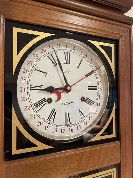 Basement. 31 day regulator clock. Approximately 24 inches tall. Includes key.